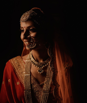 This bride’s wedding ensembles with gota patti & mirror work celebrated the vibrant textile crafts of India.